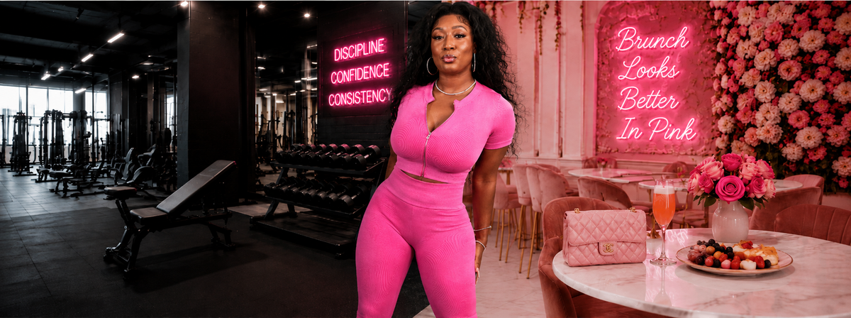 A woman in a bright pink two-piece workout set stands in a gym interior, with pink neon signs, a floral wall, and a table with drinks in the background.